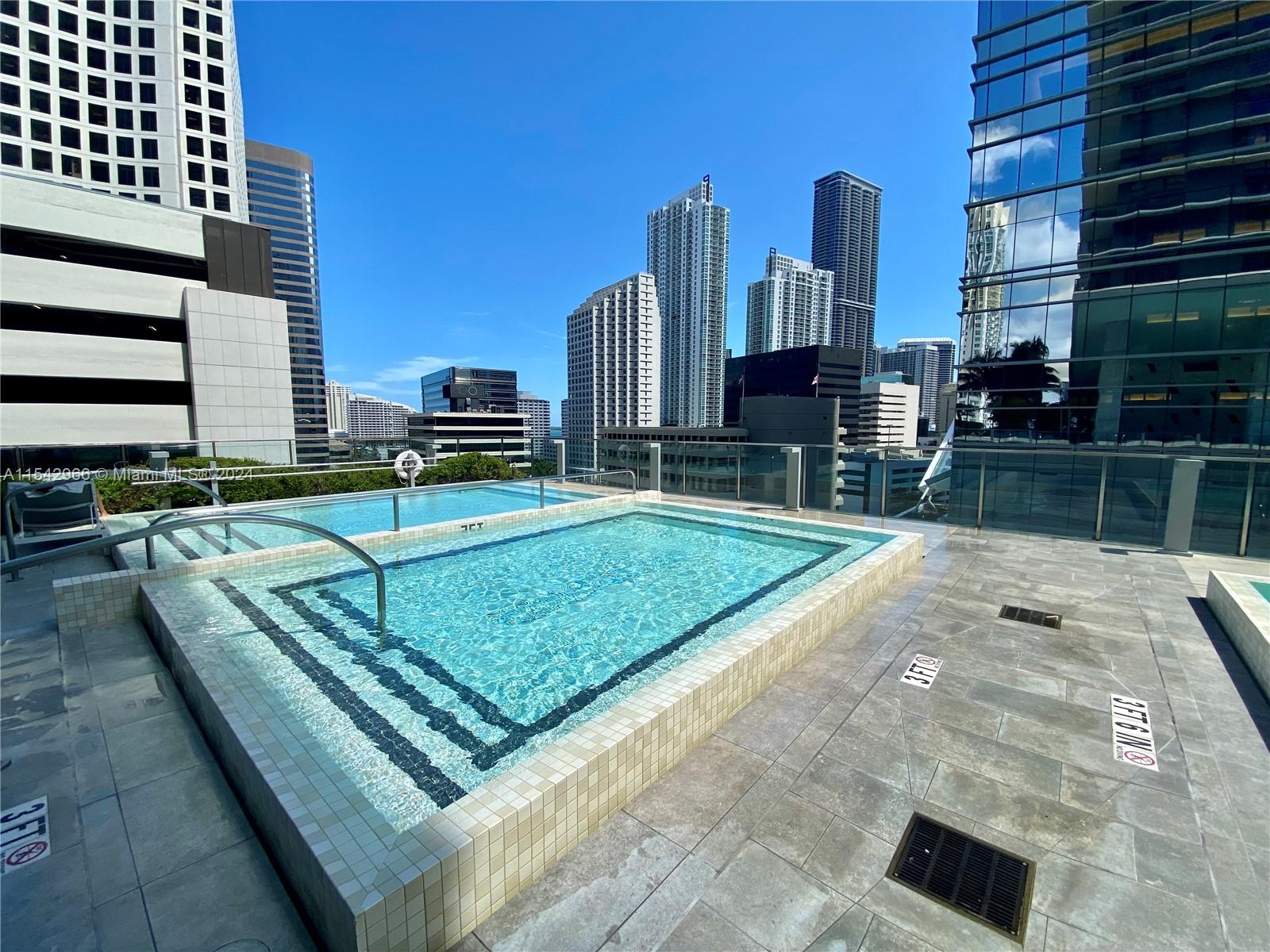 68 Southeast 6th Street, Unit 2707 Miami, FL 33131 - Photo 43 of 53 a view of a tennis court