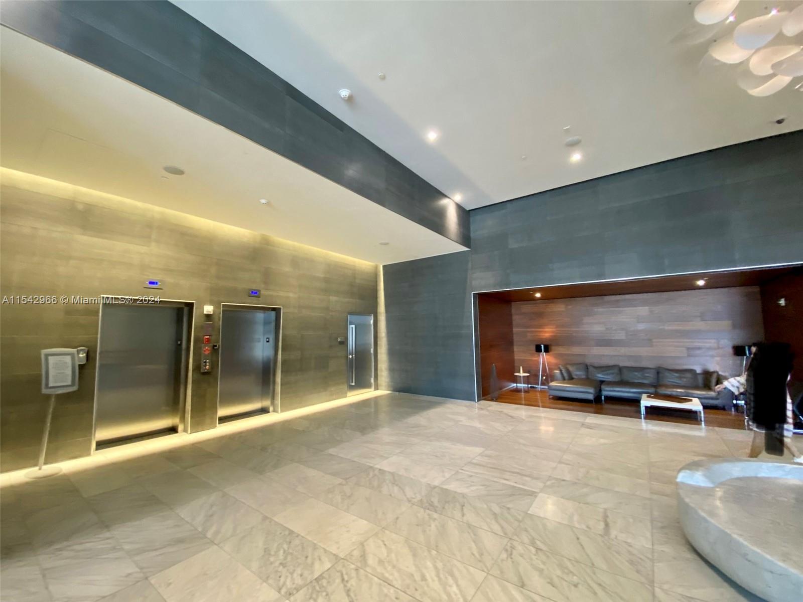 68 Southeast 6th Street, Unit 2707 Miami, FL 33131 - Photo 53 of 53 a large room with stainless steel appliances