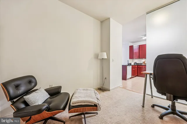 a bedroom with a workspace