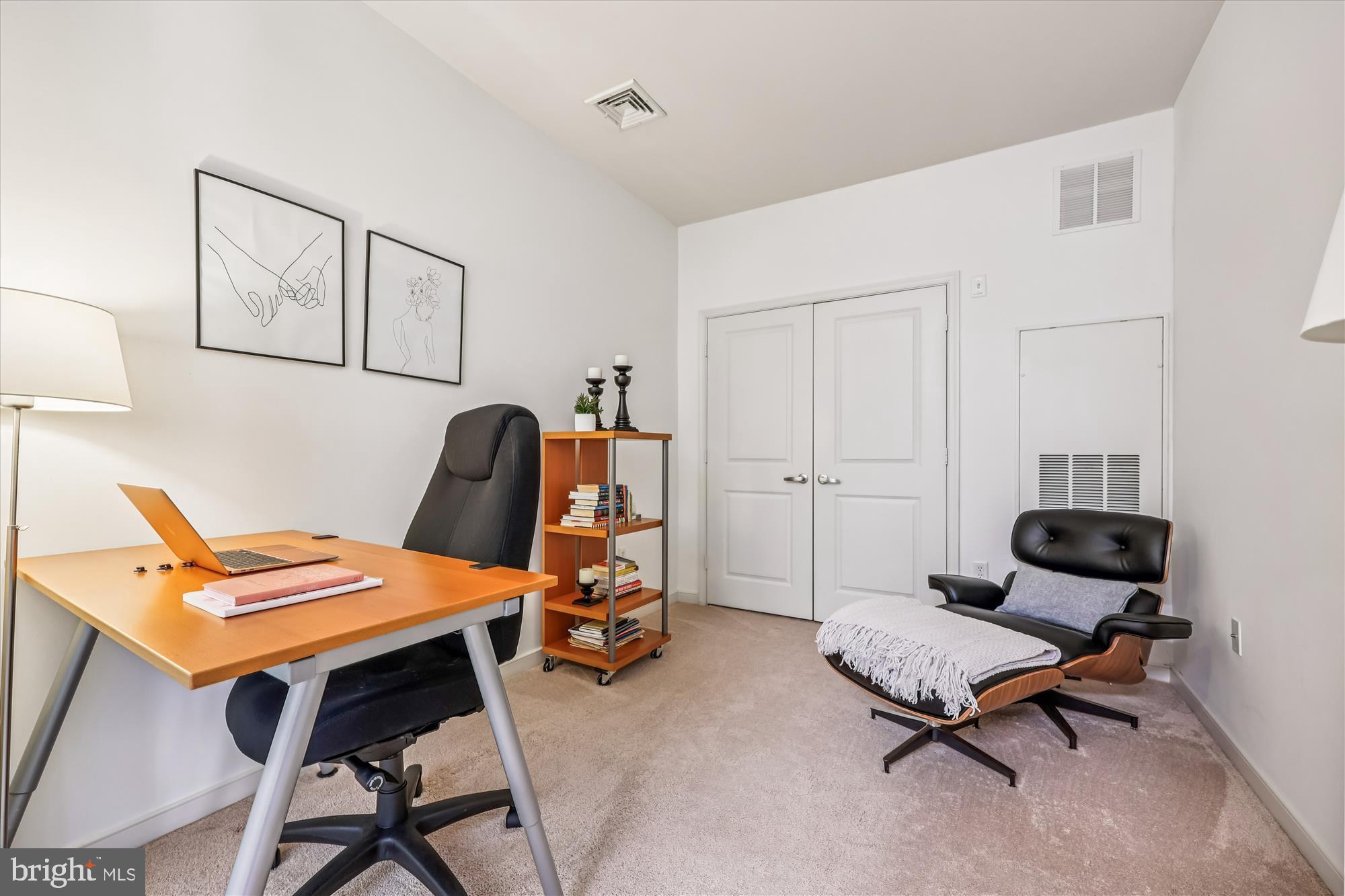 8045 Newell Street, Unit 215 Silver Spring, MD 20910 - Photo 17 of 31 a bedroom with a workspace