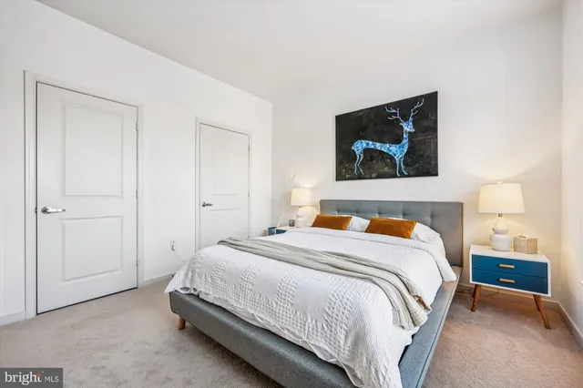 a bedroom with a bed and a dresser