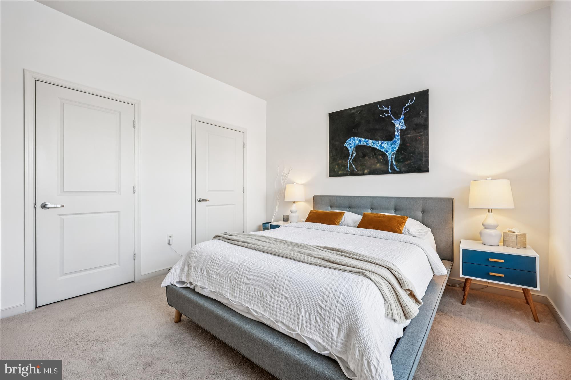 8045 Newell Street, Unit 215 Silver Spring, MD 20910 - Photo 19 of 31 a bedroom with a bed and a flat screen tv