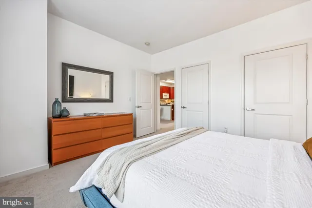 a bathroom with a double vanity sink toilet and shower