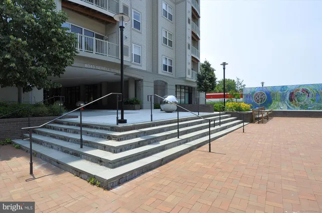 a view of pool with seating area