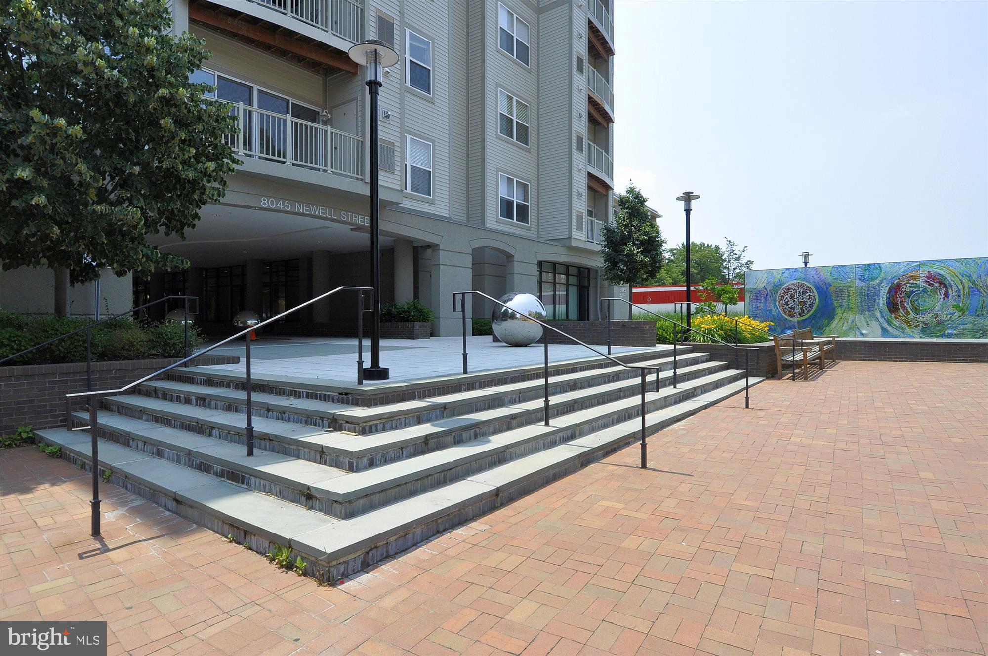 8045 Newell Street, Unit 215 Silver Spring, MD 20910 - Photo 2 of 31 a view of pool with seating area
