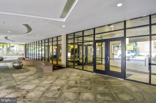 a view of house with outdoor space and sitting area