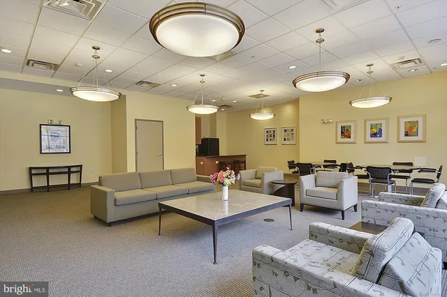 a large living room with furniture and a large window