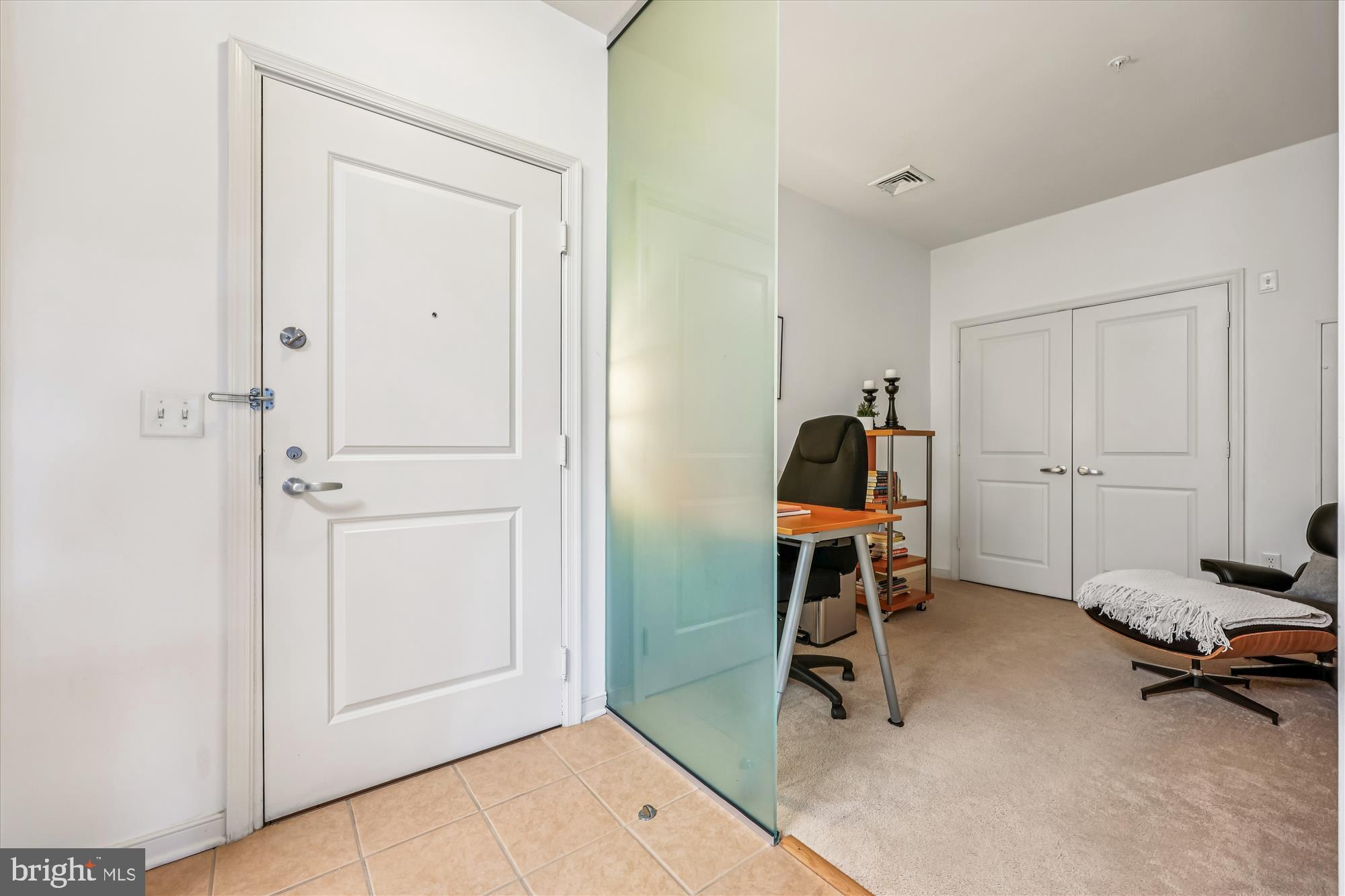 8045 Newell Street, Unit 215 Silver Spring, MD 20910 - Photo 10 of 31 a view of a room with gym equipment