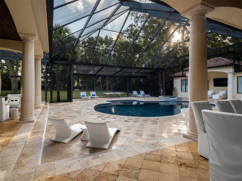 10803 Southwest 27 Avenue Gainesville, FL 32608 - Photo 13 of 78 a view of a swimming pool with sitting area