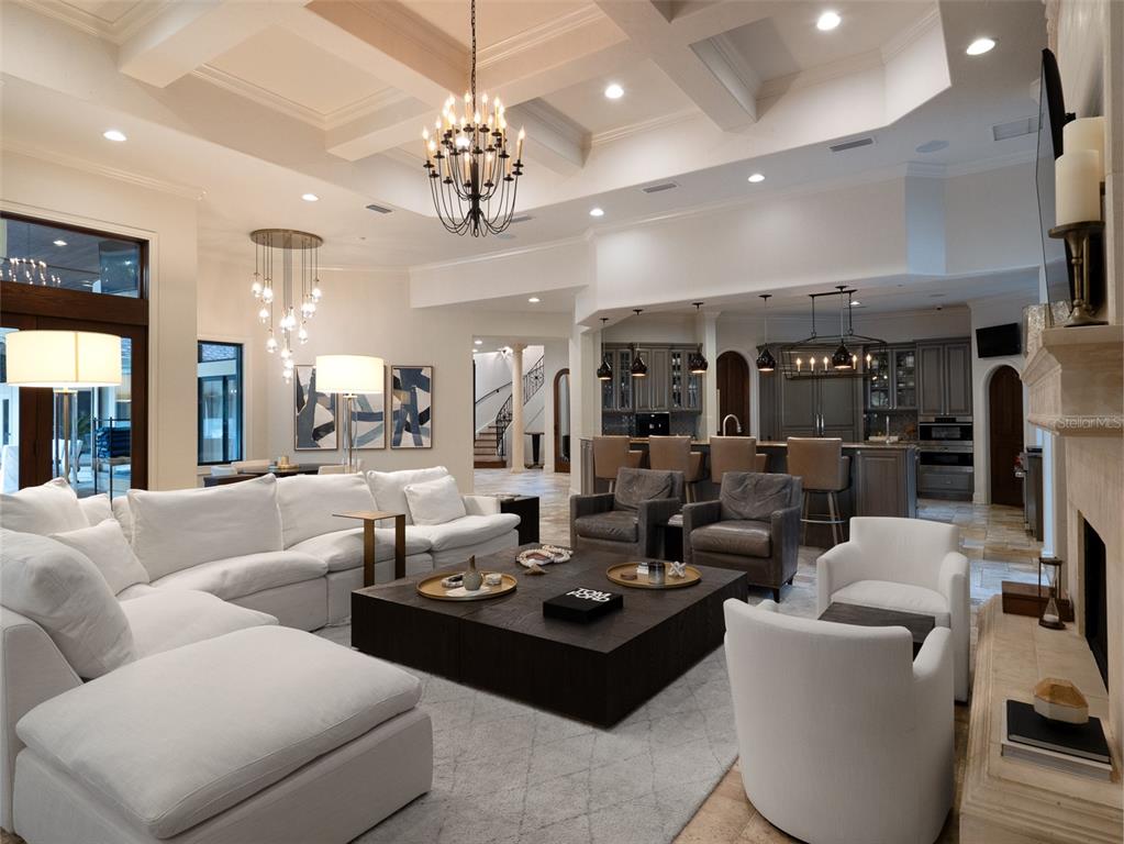 10803 Southwest 27 Avenue Gainesville, FL 32608 - Photo 27 of 78 a living room with lots of furniture and chandelier