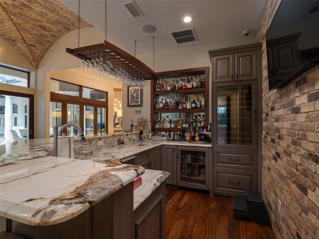 10803 Southwest 27 Avenue Gainesville, FL 32608 - Photo 30 of 78 a kitchen with stainless steel appliances granite countertop a stove and a refrigerator