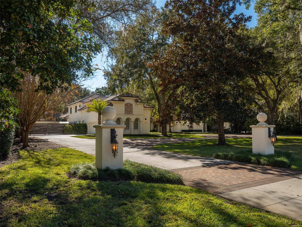 10803 Southwest 27 Avenue Gainesville, FL 32608 - Photo 5 of 78 a front view of a house with a yard and tree