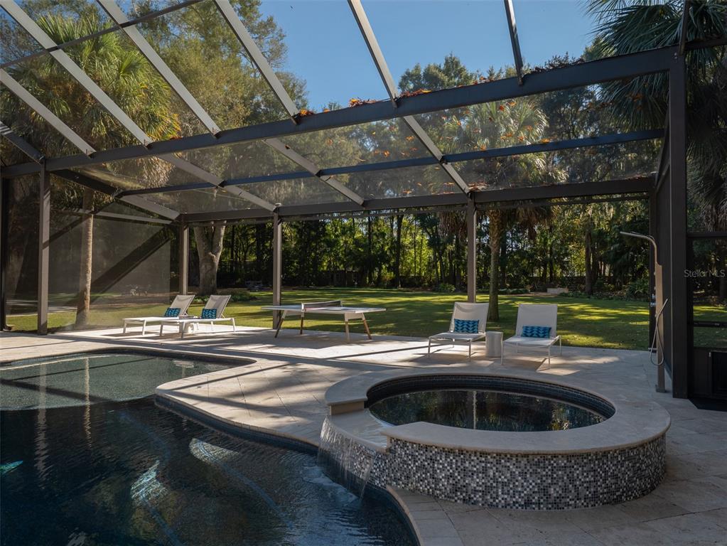 10803 Southwest 27 Avenue Gainesville, FL 32608 - Photo 67 of 78 a view of a swimming pool with a porch