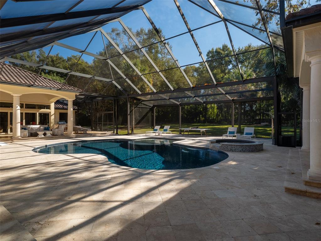 10803 Southwest 27 Avenue Gainesville, FL 32608 - Photo 68 of 78 a view of a swimming pool with a patio
