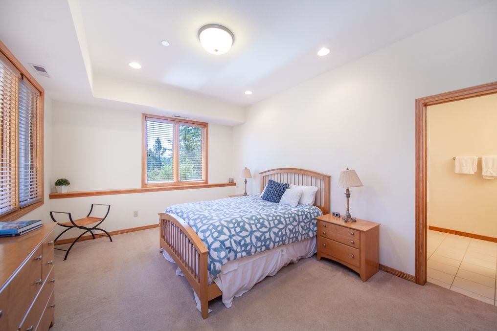317 High Meadow Drive Dillon, CO 80435 - Photo 21 of 35 a bedroom with a bed and a table in it