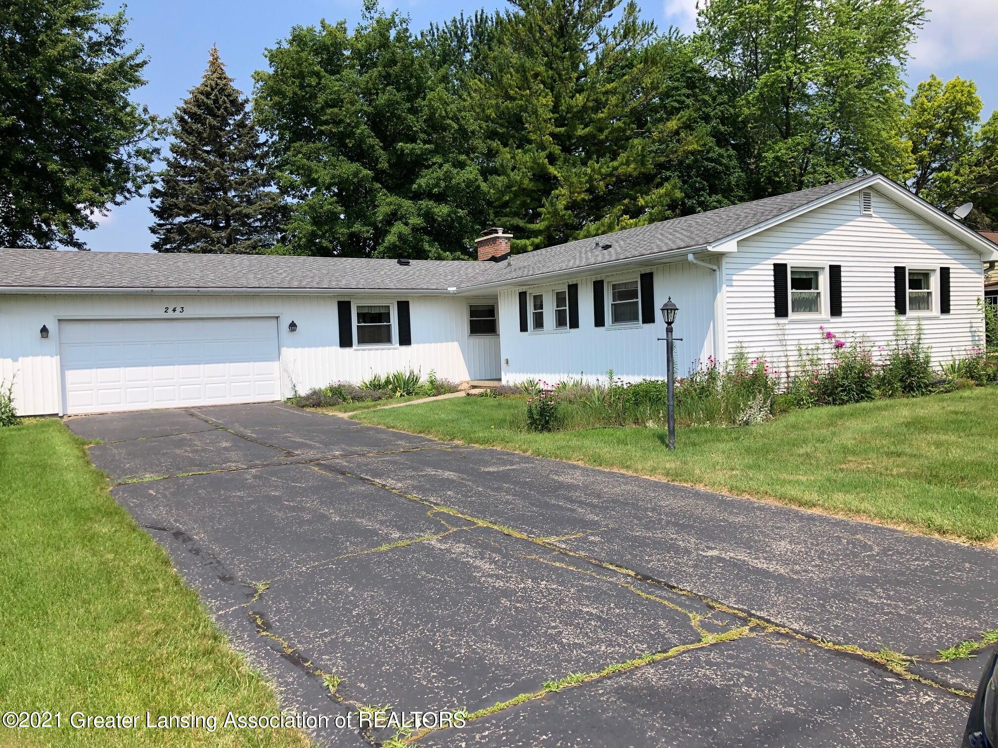 243 North Creyts Road Lansing, MI 48917 - Photo 1 of 14 Front of House
