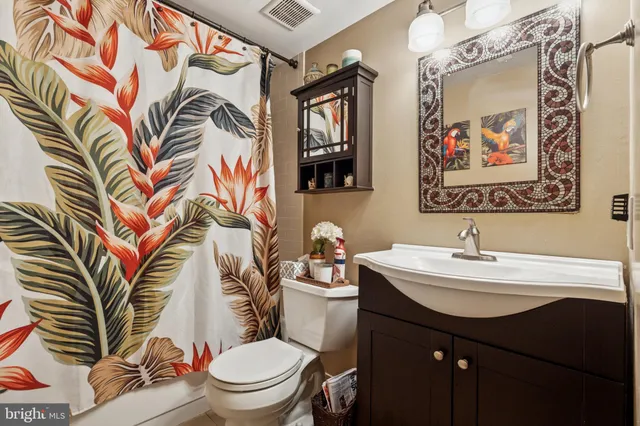 a view of a garden with a table and chairs under an umbrella