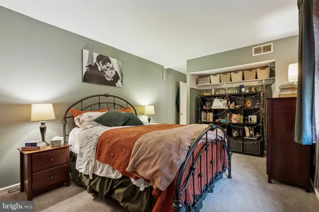 a bedroom with a bed and closet