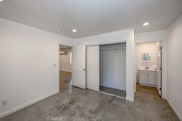 a view of a hallway with bathroom