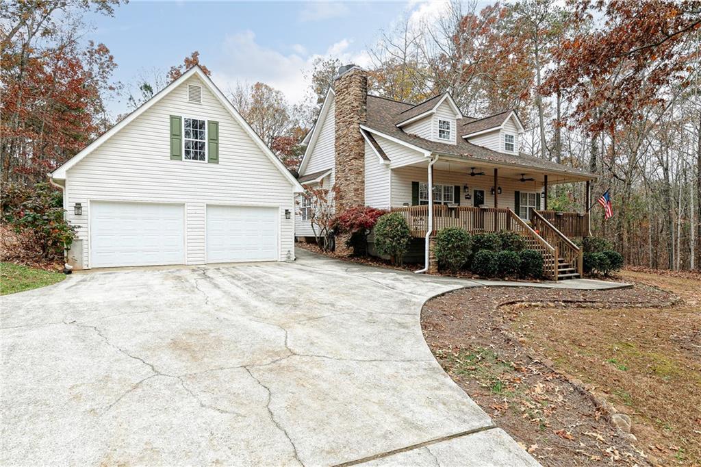 8092 Banks Mill Road Douglasville, GA 30135 - Photo 1 of 1 a view of a white house with a yard and plants