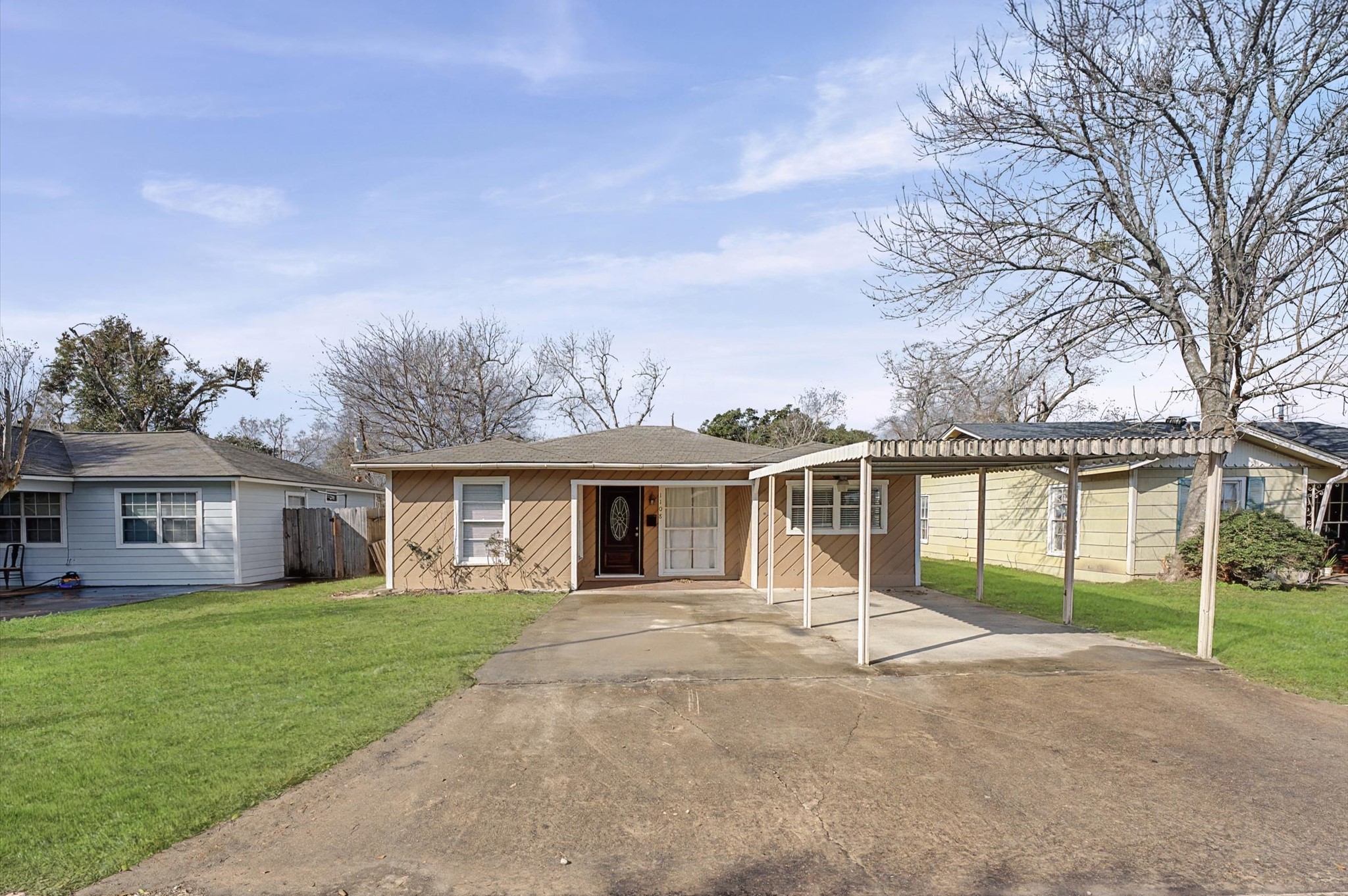 front view of a house with a yard
