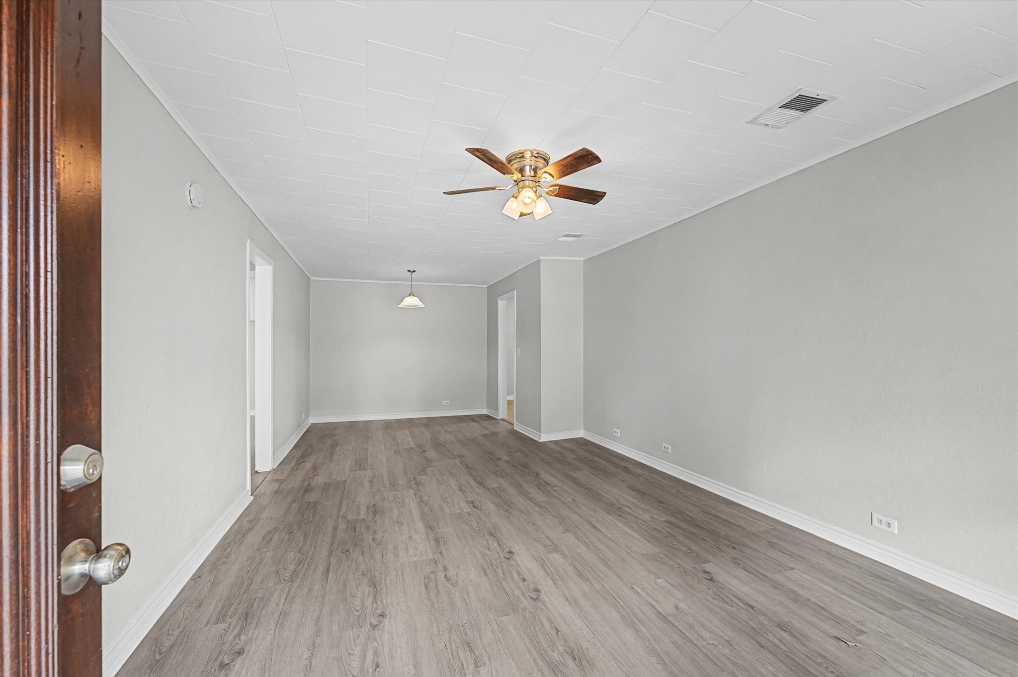 1108 Georgina Street Rosenberg, TX 77471 - Photo 3 of 15 wooden floor in an empty room with a window