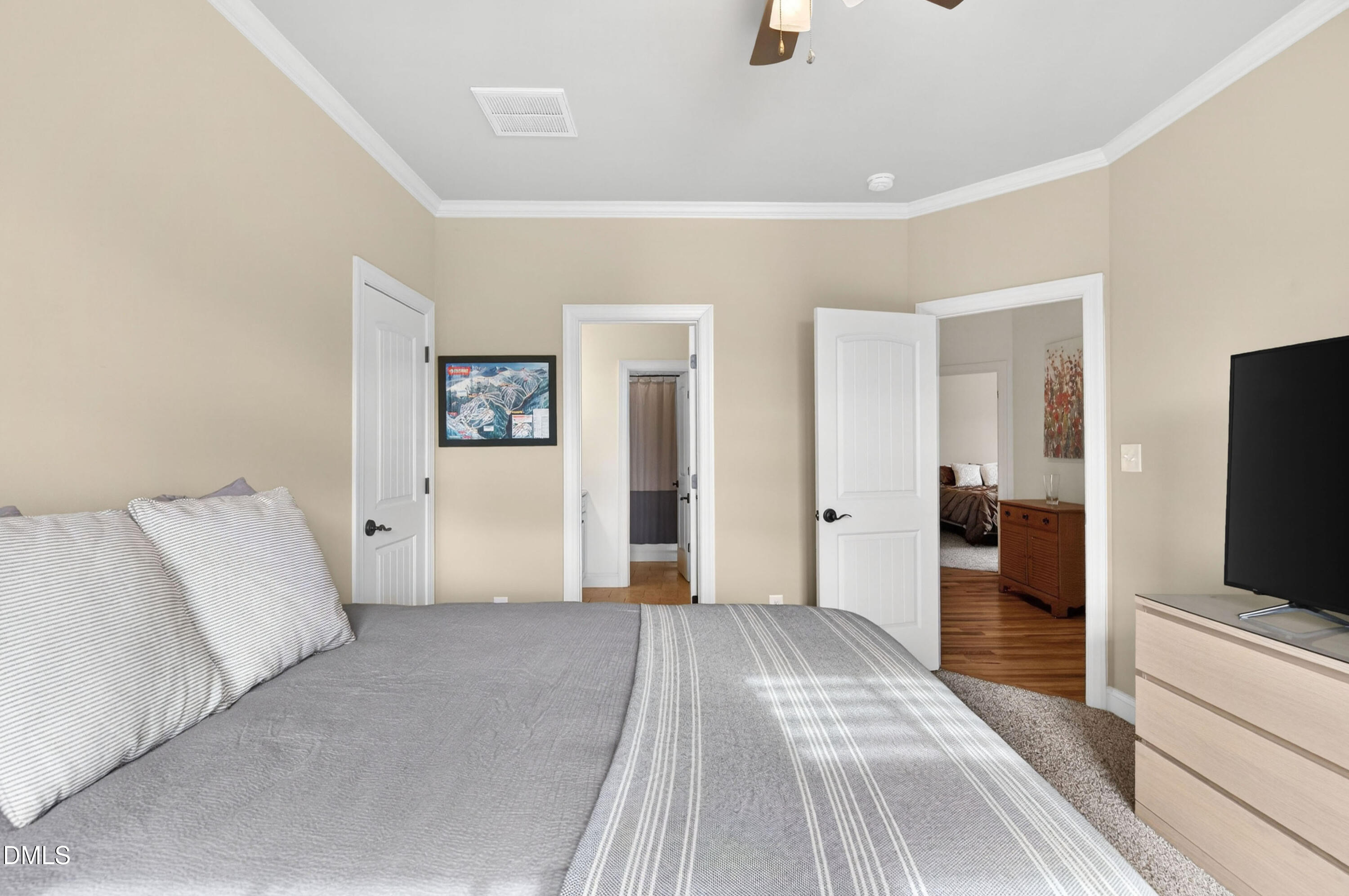 691 Hawthorne Place Creedmoor, NC 27522 - Photo 55 of 84 a bedroom with a bed and a flat screen tv