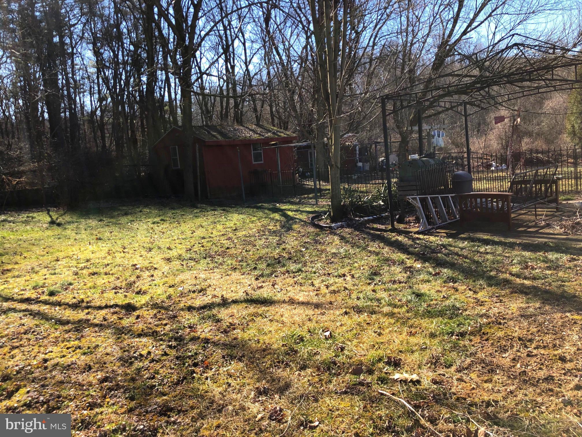 480 North Ridge Road Reinholds, PA 17569 - Photo 6 of 8 flat back yard with shed and dog run/chicken house