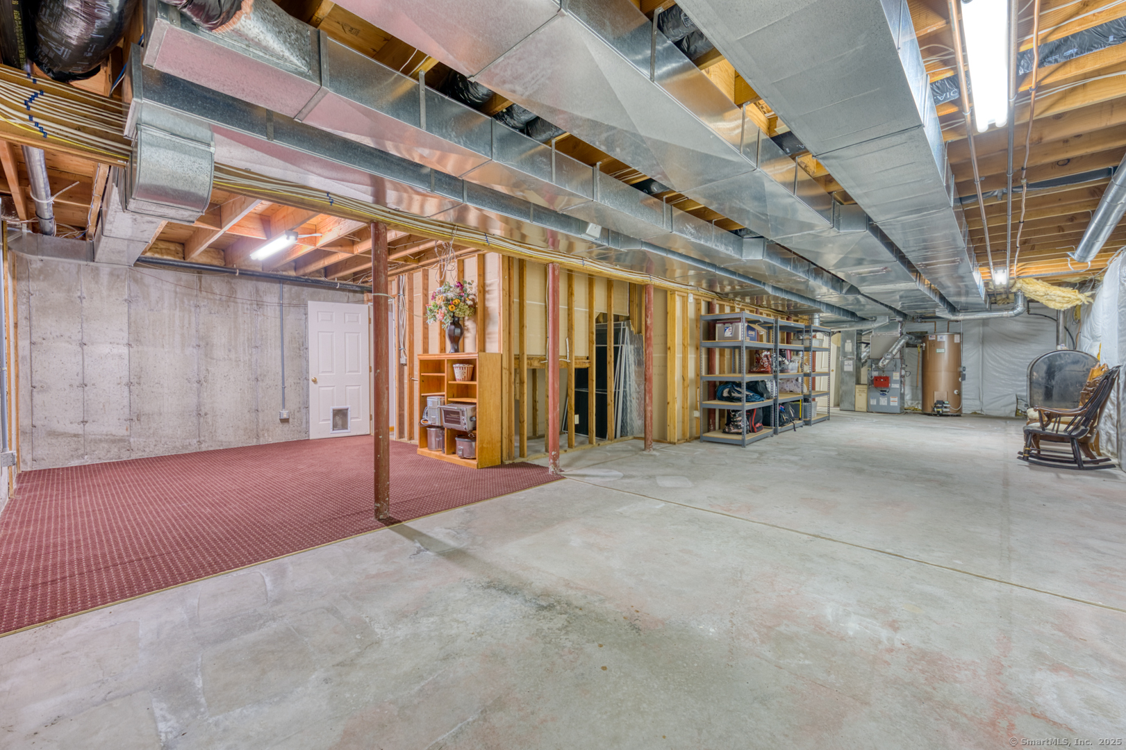 34 Hanover Farms Road Bolton, CT 06043 - Photo 26 of 39 Unfinished area of the basement. Loads of potential for many uses and storage. Access direct to the garage also.