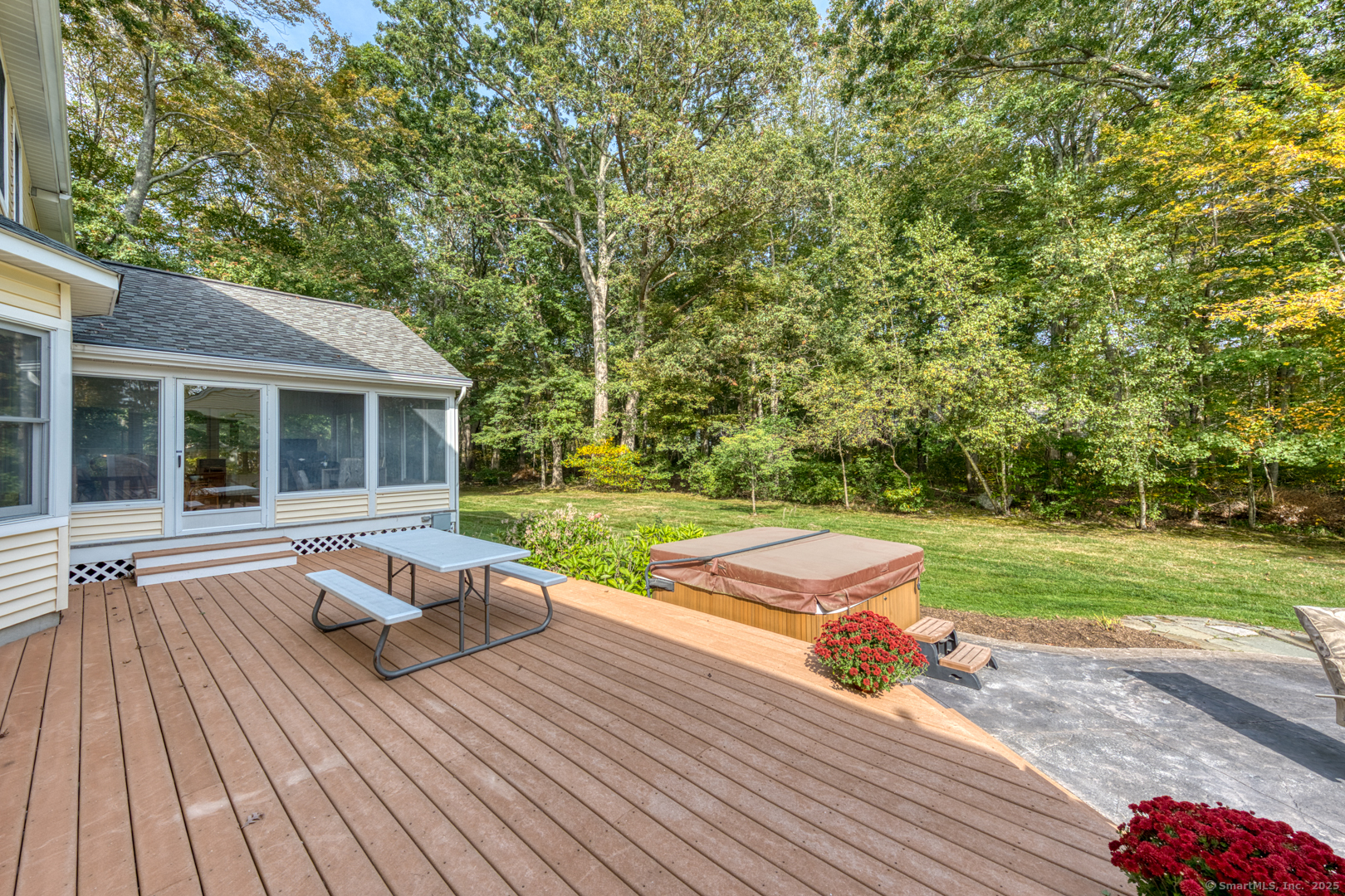 34 Hanover Farms Road Bolton, CT 06043 - Photo 28 of 39 Head out from the sunroom to your expansive deck and patio, to the large, level yard.