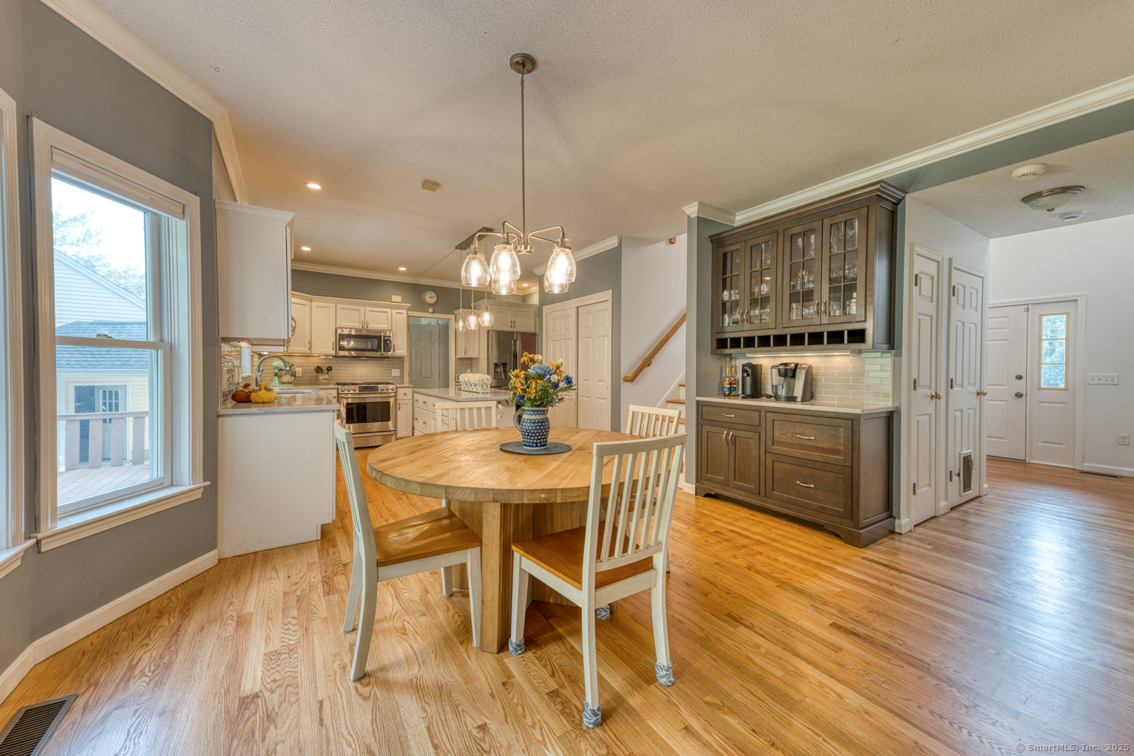 34 Hanover Farms Road Bolton, CT 06043 - Photo 6 of 39 Gorgeous remodeled kitchen open to the cozy LR wih fireplace.