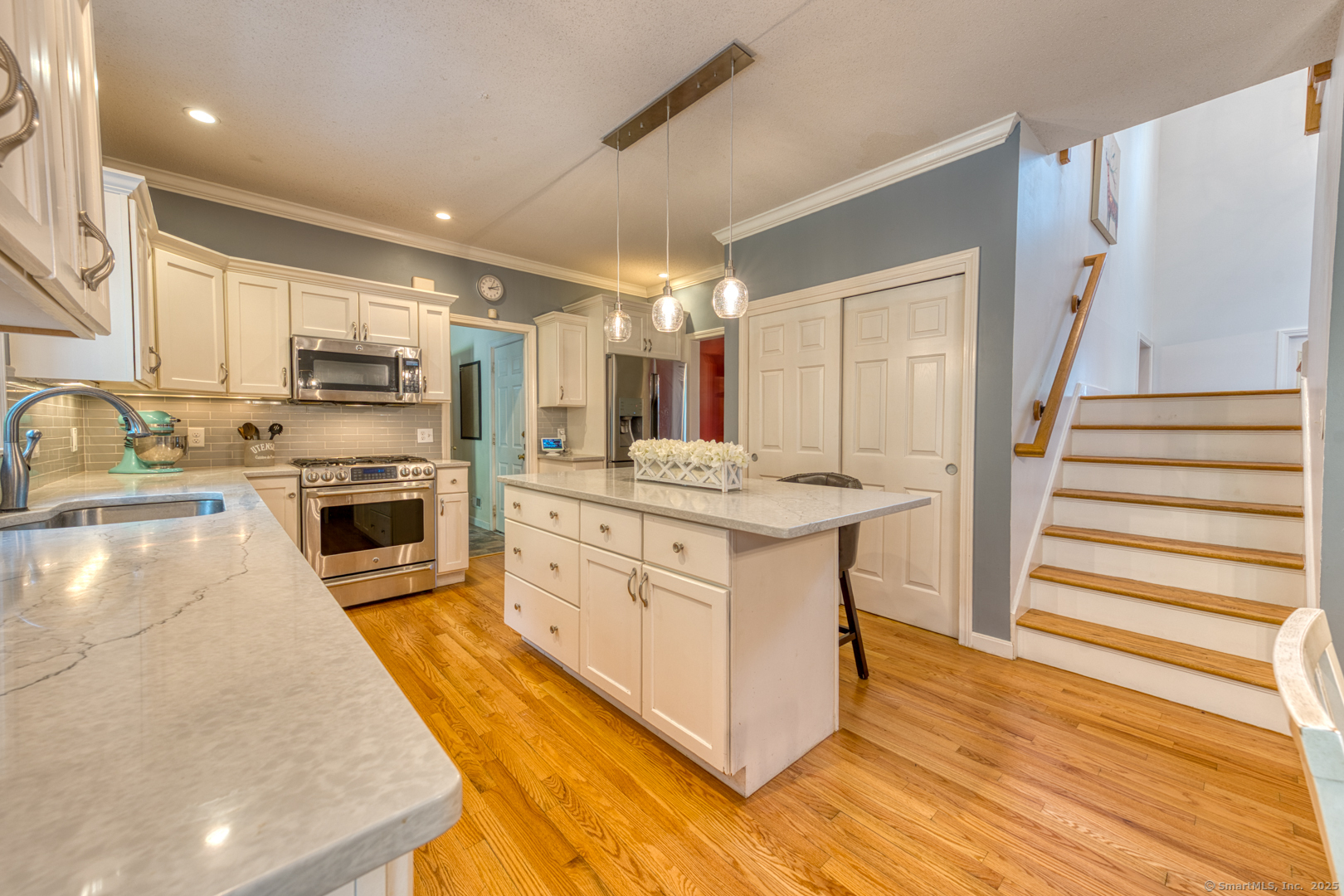 34 Hanover Farms Road Bolton, CT 06043 - Photo 8 of 39 Notice the split staircase accessed from the kitchen too!
