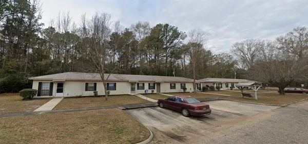 a swimming pool with outdoor seating and yard