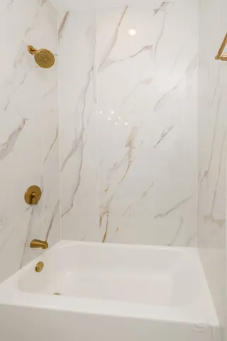 a bathroom with a bathtub