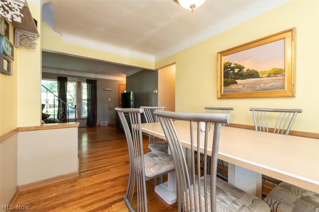 1100 Haverston Road Lyndhurst, OH 44124 - Photo 6 of 24 Dining Room with Hardwood Floors and Door Leading to
the Deck