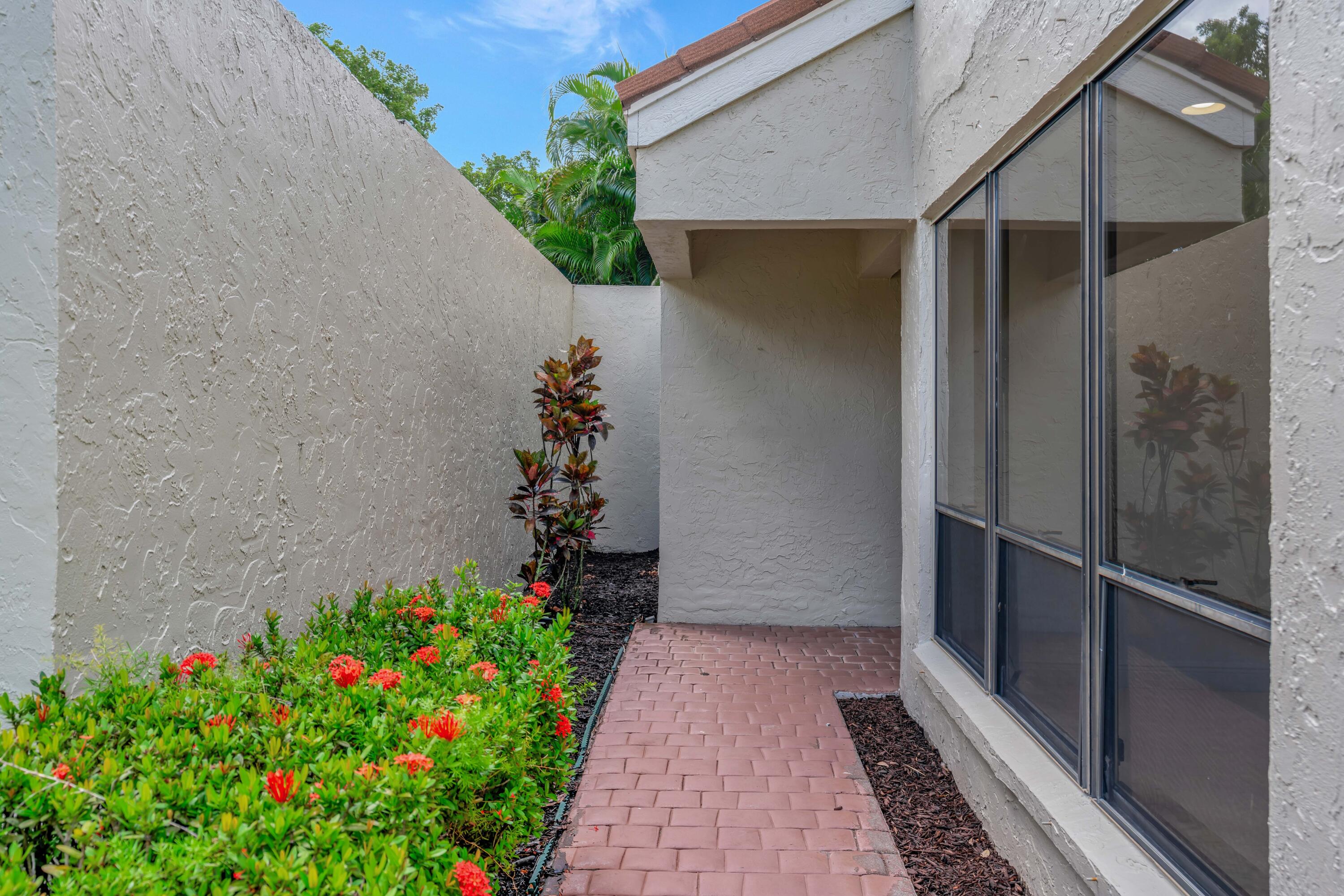 64 Balfour Road East Palm Beach Gardens, FL 33418 - Photo 4 of 31 Private Side Entry