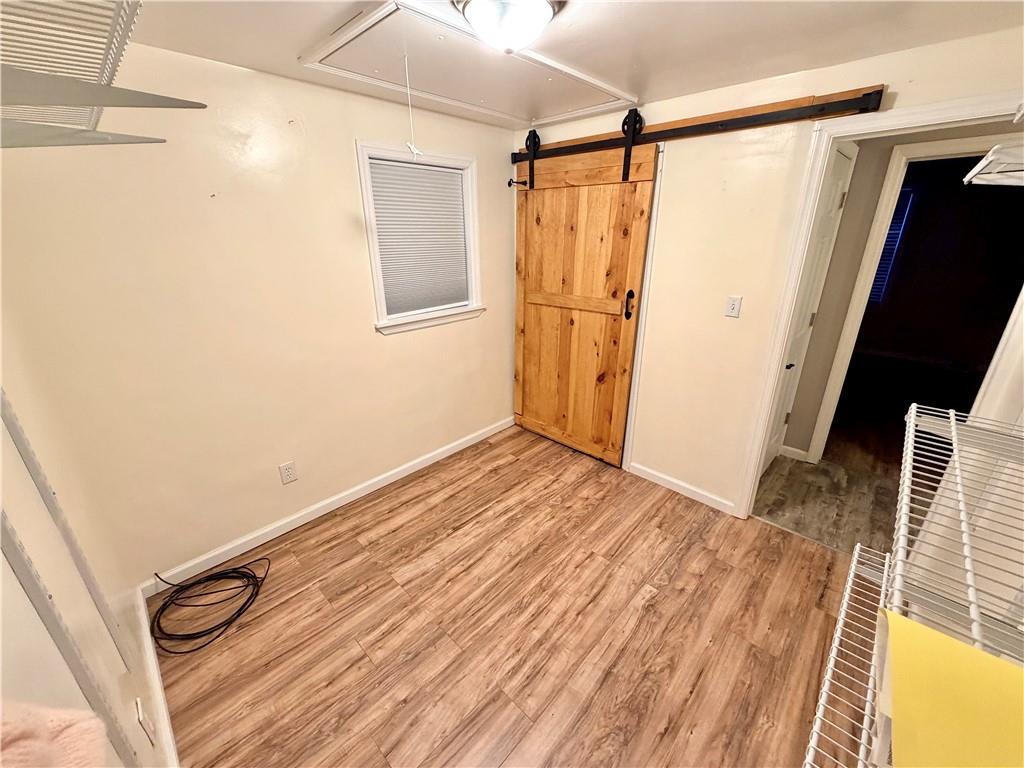 166 Jr Street Hopwood, PA 15445 - Photo 18 of 23 a view of a room with wooden floor and white walls