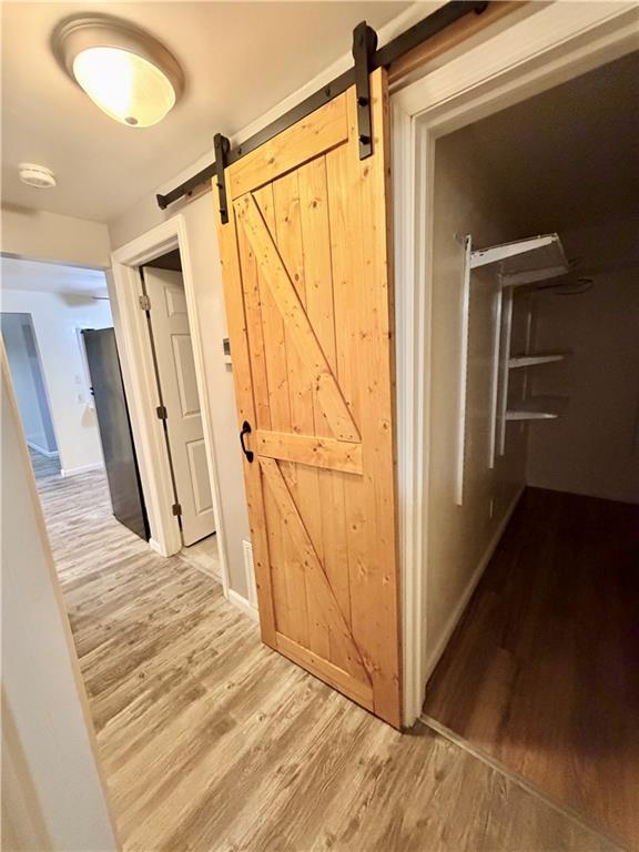 166 Jr Street Hopwood, PA 15445 - Photo 19 of 23 a view of a hallway with wooden floor and staircase