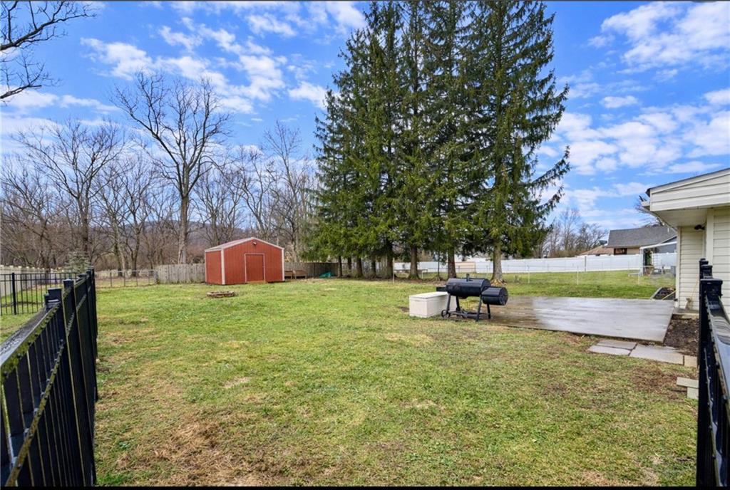 166 Jr Street Hopwood, PA 15445 - Photo 21 of 23 a view of a garden with a slide