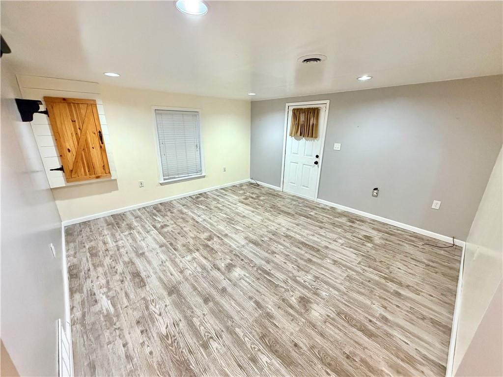 166 Jr Street Hopwood, PA 15445 - Photo 5 of 23 a view of empty room with wooden floor