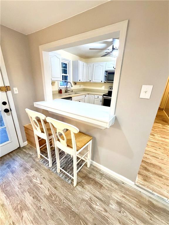 166 Jr Street Hopwood, PA 15445 - Photo 8 of 23 a dining room with wooden floor and a window