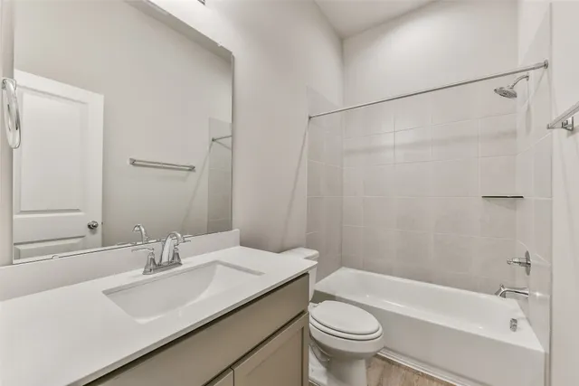 a bathroom with a sink a toilet and a bathtub