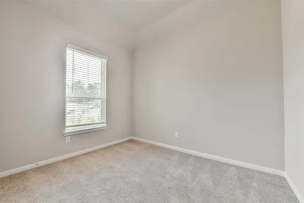 an empty room with closet area