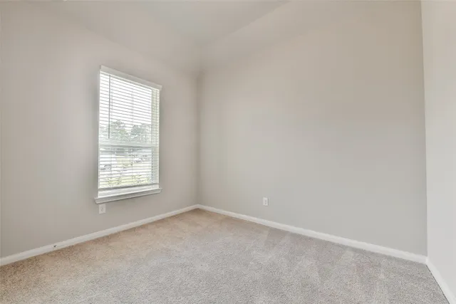 an empty room with closet area