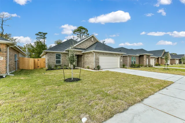 a white house with a large pool and a yard