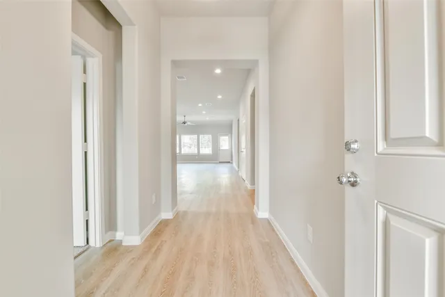 a view of a bathroom from the hallway