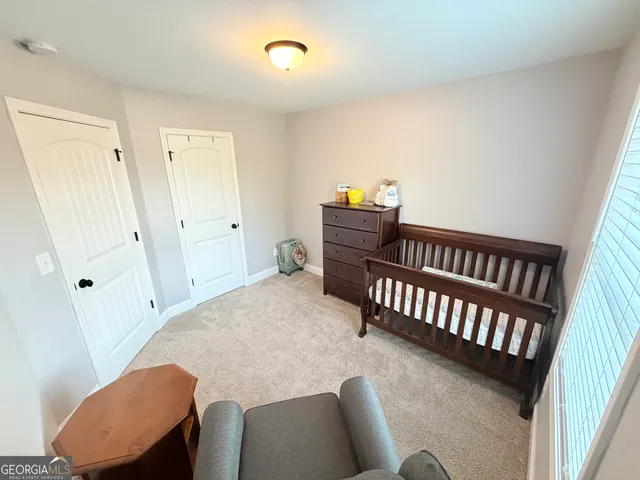 a bedroom with furniture and a window