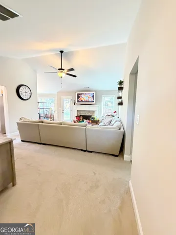 a living room with furniture and window