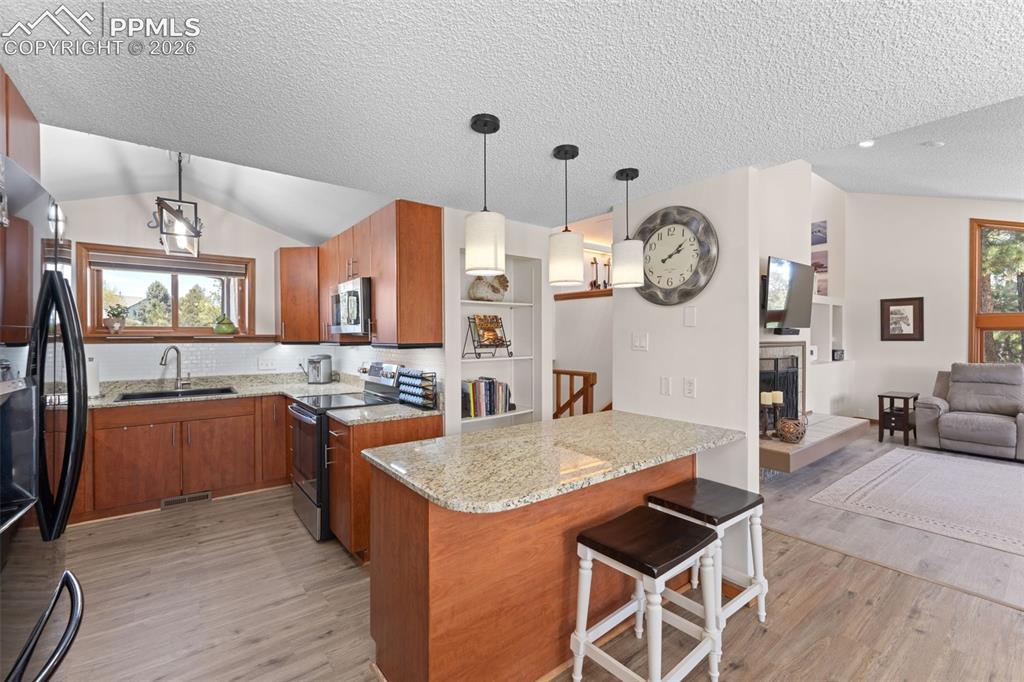 1851 Buttercup Road Elizabeth, CO 80107 - Photo 20 of 47 a large kitchen with a table and chairs