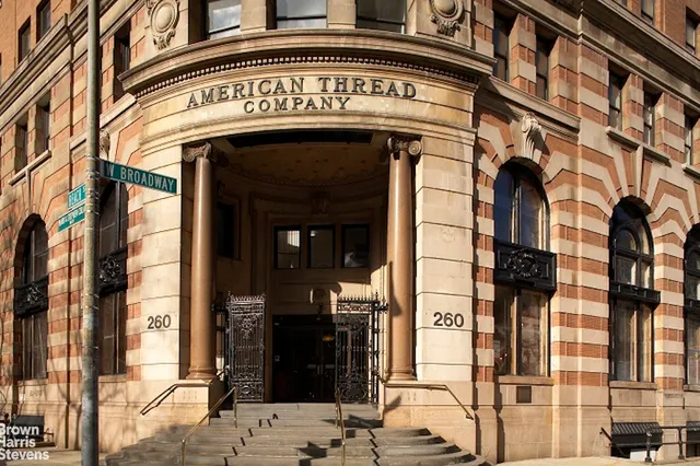 a view of a building with a street sign